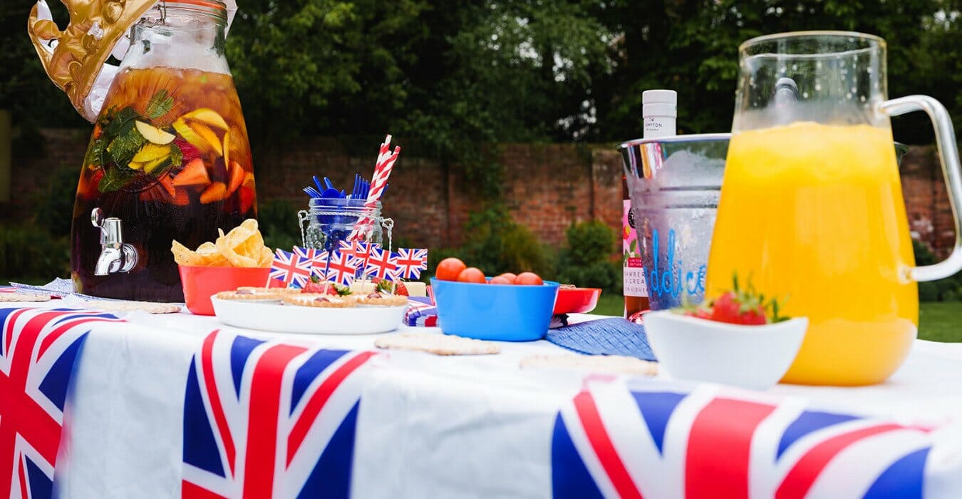 A table full of nibbles and drinks Platinum jubilee themed
