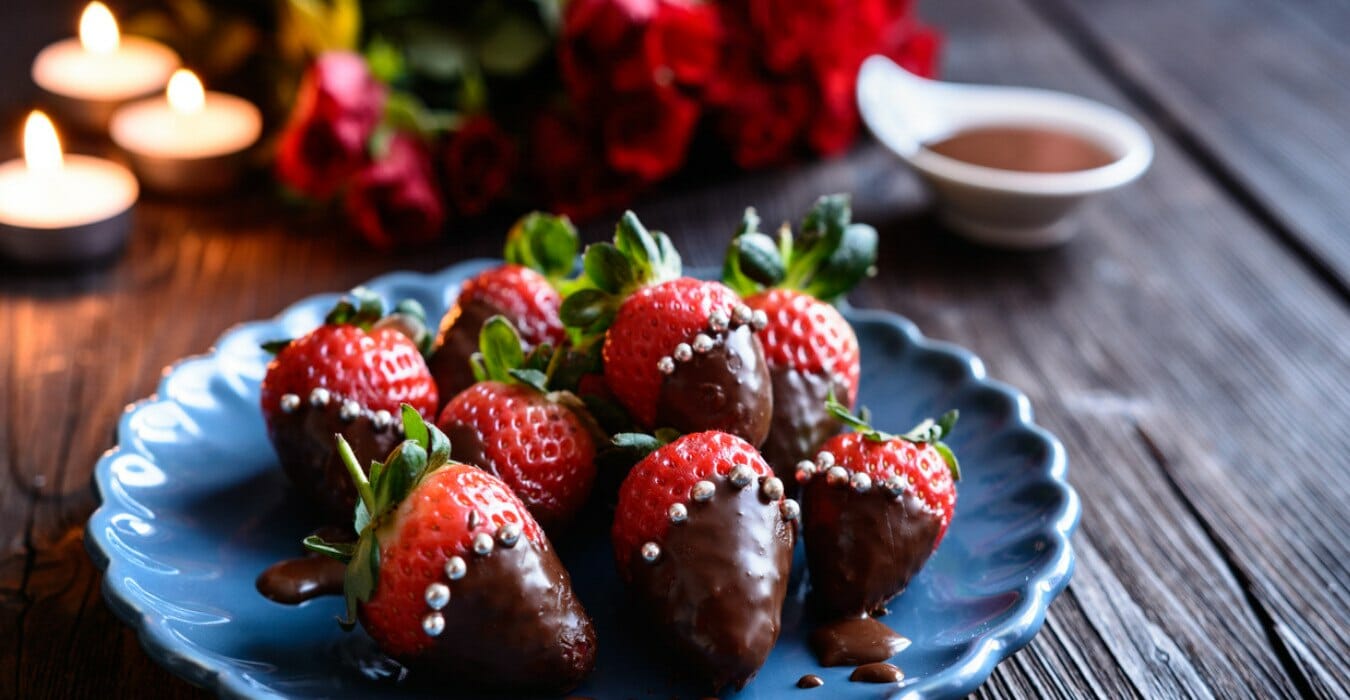 Strawberries dipped in chocolate on a plate