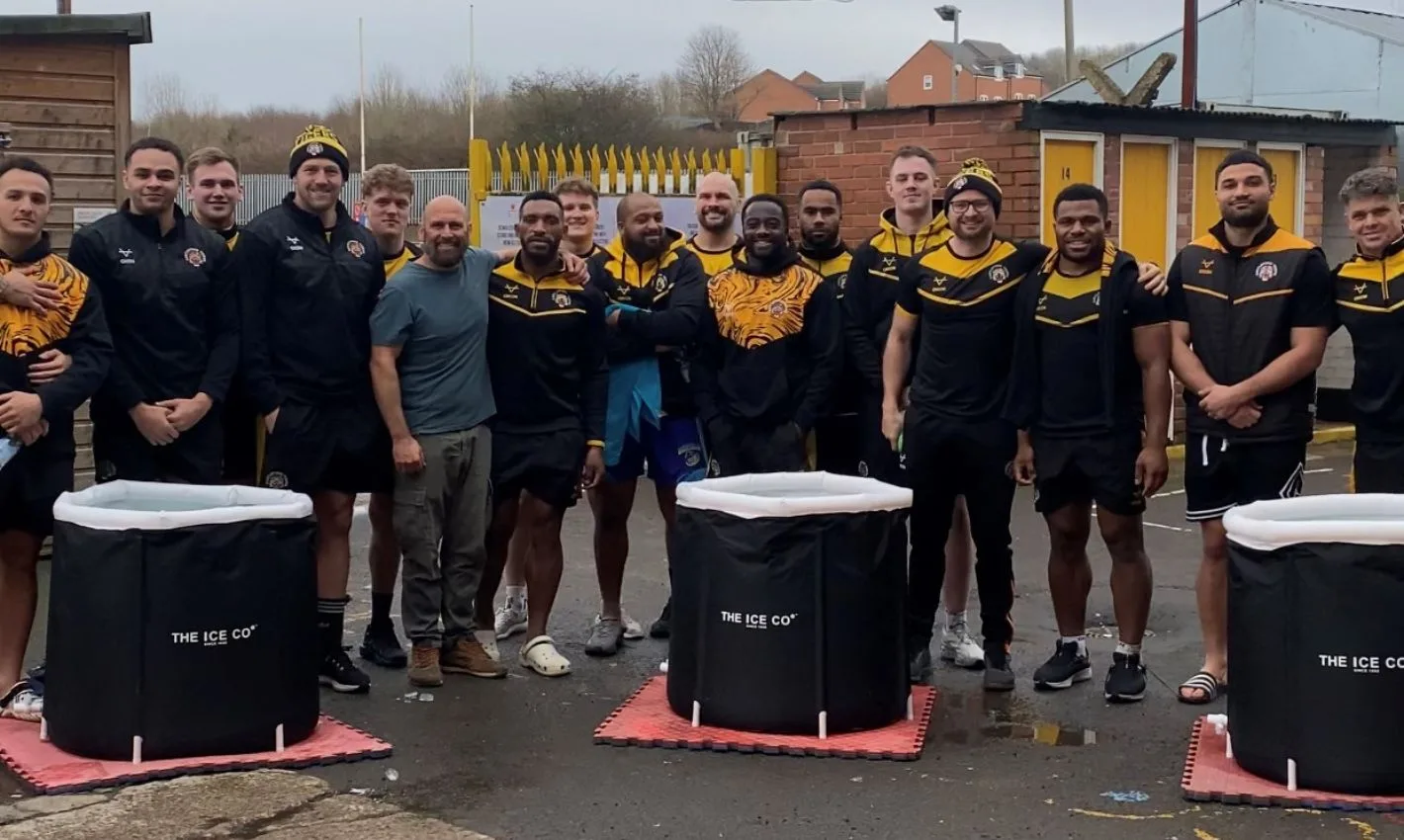 Castleford Tigers Rugby Squad pose for picture behind The Ice Co Ice Baths