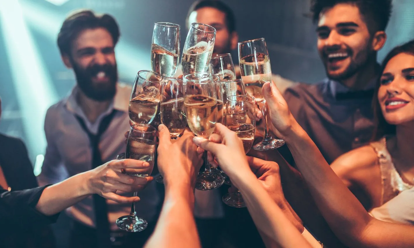 Group of friends toasting with champagne