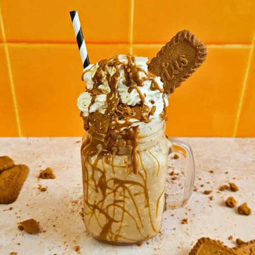 Biscoff Frappe topped with whipped cream and Lotus Biscoff biscuits