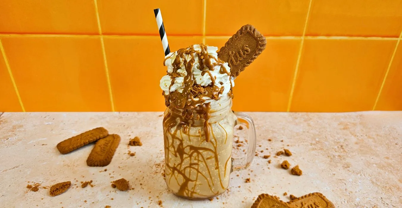 Biscoff Frappe topped with whipped cream and Lotus Biscoff biscuits