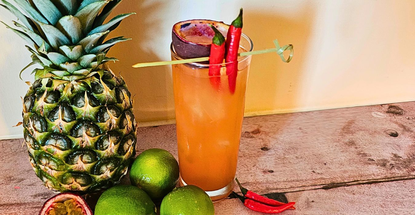 aries firey passion cocktail with fresh pineapple, limes and passionfruit