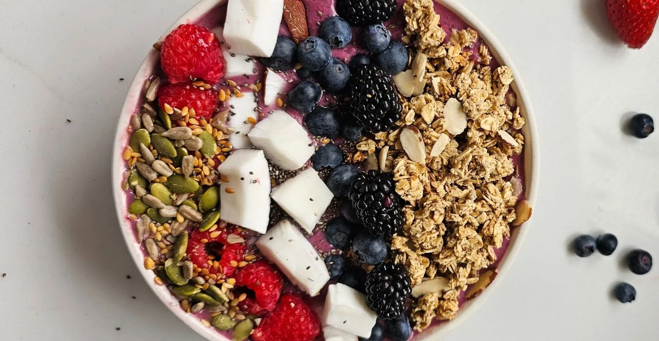 mixed berry smoothie bowl, granola and fruits