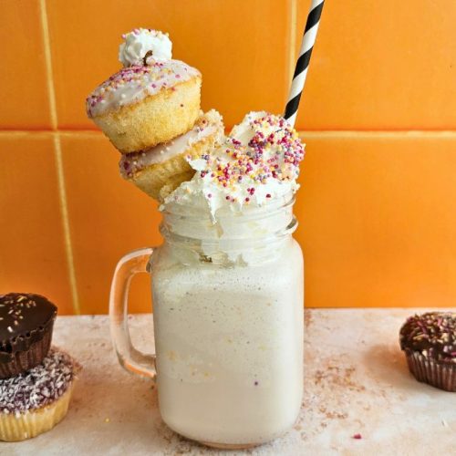 Birthday Cake Milkshake Recipe with whipped cream and birthday cupcakes