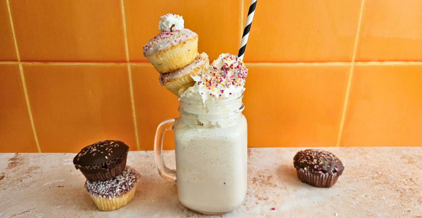 Birthday Cake Milkshake Recipe with whipped cream and birthday cupcakes