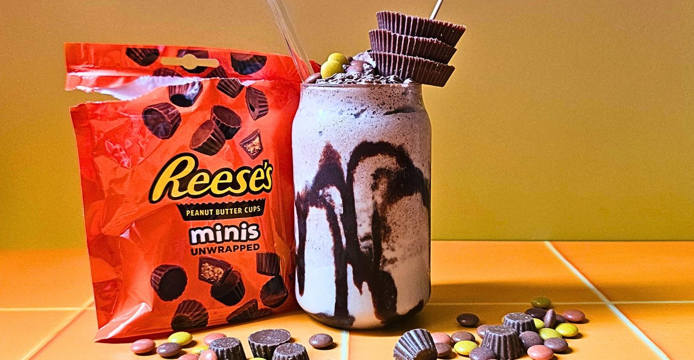 Reese's Peanut Butter Milkshake surrounded by Reese's Pieces