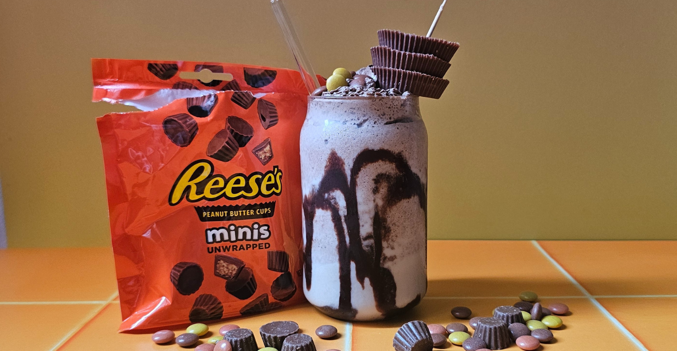 Reese's Peanut Butter Milkshake surrounded by Reese's Pieces