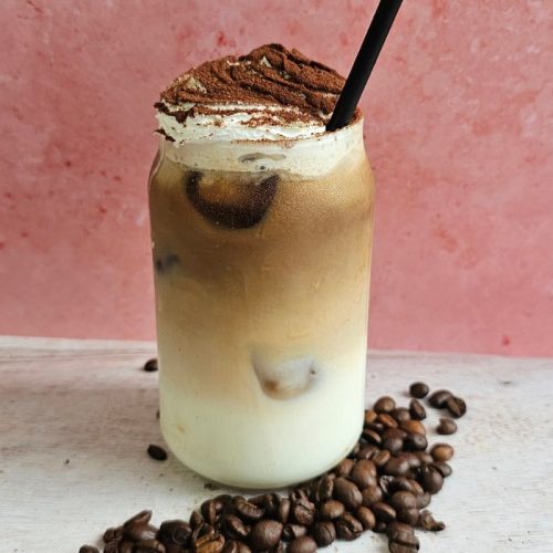M&S Tiramisu Iced Latte Dupe, topped with whipped cream with a chocolate dusting garnish, delicious!