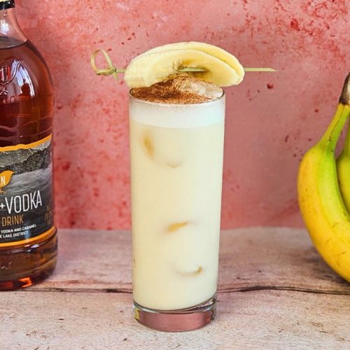 kins banoffee bliss coktail next to bannanas and a bottle of kin vodka