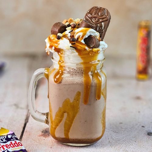 chocolate caramel milkshake with caramel sauce, whipped cream and caramel chocolate