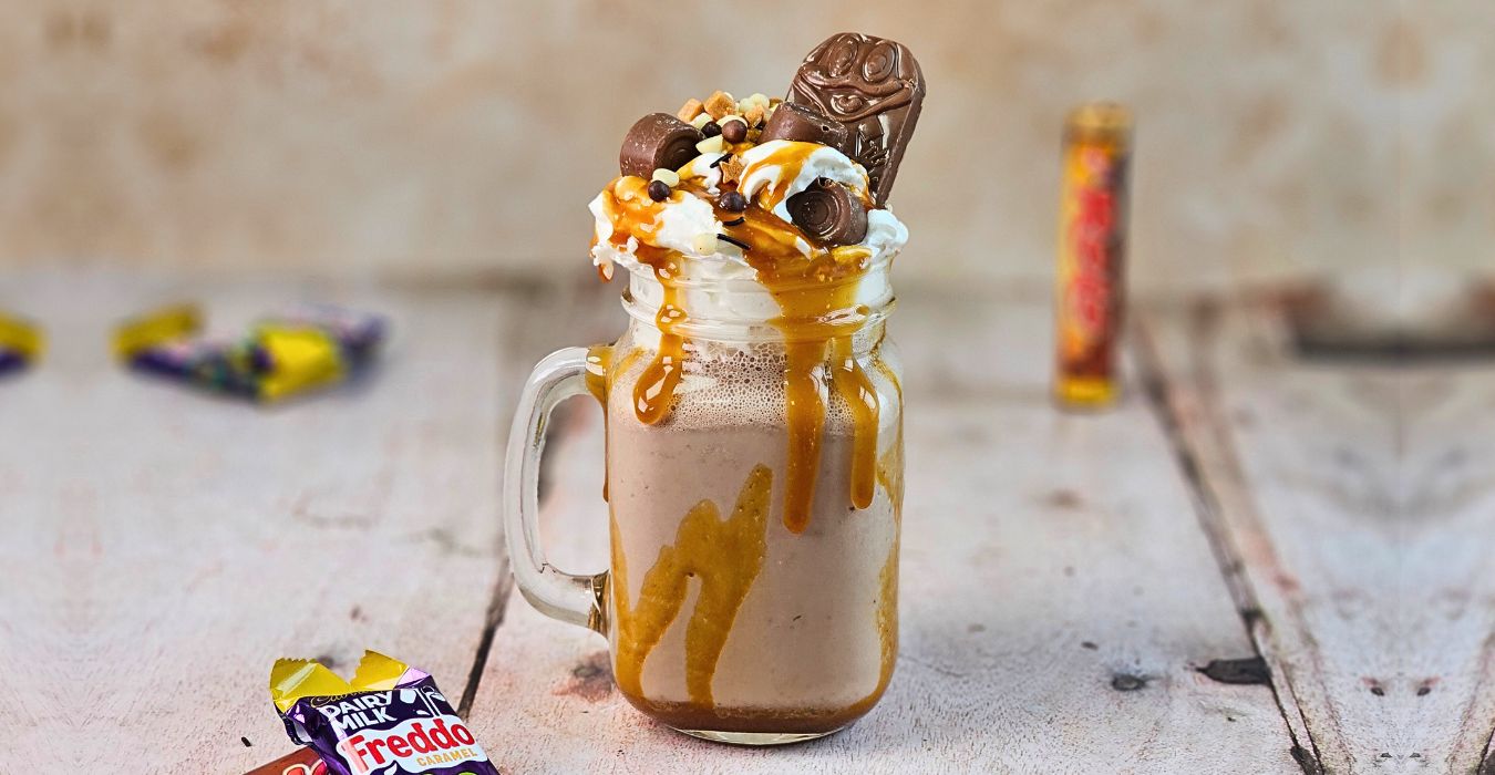 chocolate caramel milkshake with caramel sauce, whipped cream and caramel chocolate