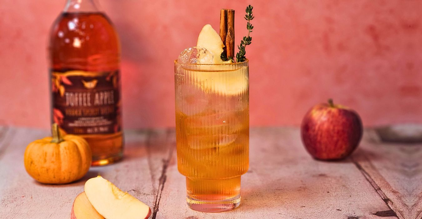 Kin Toffee Apple Spritz cocktail with cinnamon, apple and thyme